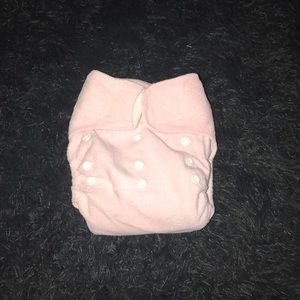 A pink cloth diaper